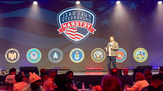 Director of Military Student Success Aaron Hall hosts Thanksgiving dinner in the Full Sail Live venue.